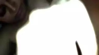 Indian slut lies in bed while XXX boyfriend has oral sex with her