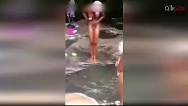 Lewd amateur Desi aunty flashing her nice big tits while bathing outdoor