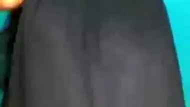 Desi female in a long black skirt exposes legs and boobies in sex show