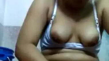Lovely Desi teen in sexy bra rubs moist XXX vagina in the bathroom